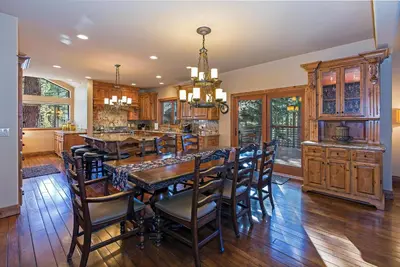 a kitchen with a large wooden table and chairs at Luxury 4 bedroom 4 5 bath luxury home that sleeps 10 in Incline Village