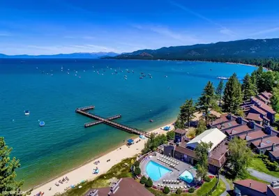 an aerial view of a beach with a pier at Private beach, Close to ski, Resort Amenities! in South Lake Tahoe