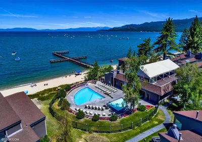 an aerial view of a house with a swimming pool and a beach at Private beach, Close to ski, Resort Amenities! in South Lake Tahoe