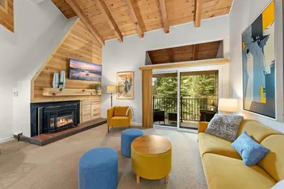 a living room with a couch and a fireplace at Carnelian Woods # 59 - 2 BR Carnelian Bay Retreat - Minutes to Lake w HOA Amenities in Carnelian Bay