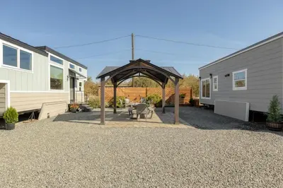 a backyard with a gazebo and a house at Tiny Home | Lewis Ranch 1 in Lindsay