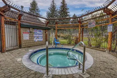 a hot tub in the middle of a patio at Luxurious 2BD Smart Home Near Beach in Tahoe City