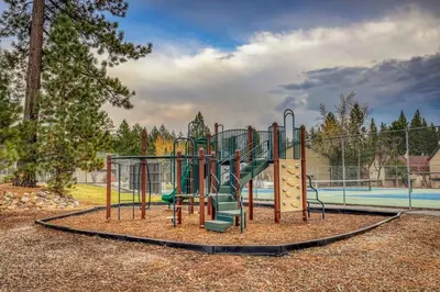 a playground with a slide in a park at Luxurious 2BD Smart Home Near Beach in Tahoe City