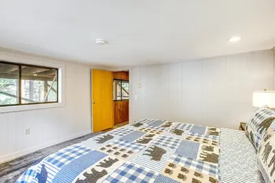 a bedroom with a bed and a window at 4 Mi to Slopes Family-Friendly Stateline Home! in Stateline