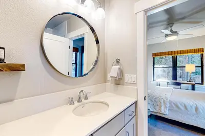 a bathroom with a sink and a mirror at Twilight's Rest in Zephyr Cove