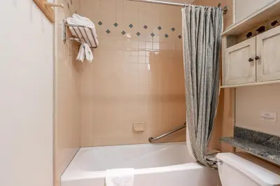a bathroom with a tub and a shower at Juniper Springs Lodge #412 - Luxury Ski in Ski out! 2 Bedroom in Mammoth Lakes