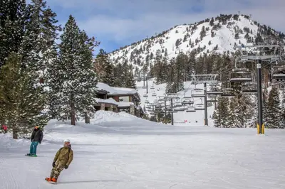 two people standing in the snow at a ski resort at Horizons 4 101 in Mammoth Lakes