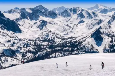 a group of people skiing down a snow covered mountain at Horizons 4 138 in Mammoth Lakes
