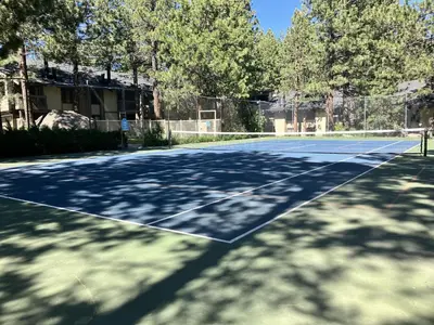 a tennis court with trees on the side at Horizons 4 158 in Mammoth Lakes