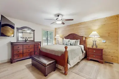 a bedroom with a bed and a ceiling fan at Gold Bear in Truckee