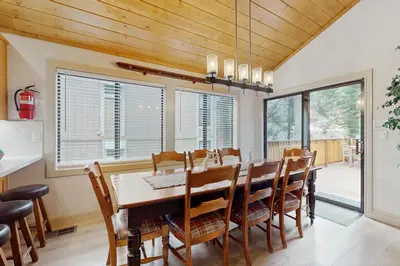 a dining room with a table and chairs at Gold Bear in Truckee