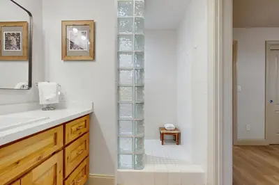 a bathroom with a glass shelf in the wall at Gold Bear in Truckee