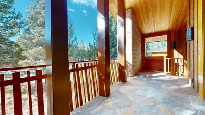 a balcony of a house with a view of trees at Obsidian #1 home in Mammoth Lakes
