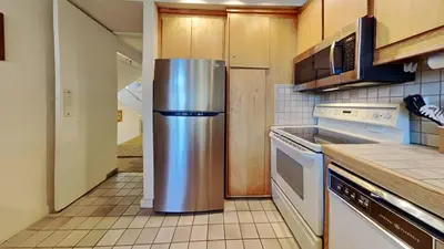 a kitchen with a stainless steel refrigerator in it at 1849 Condos 631 home in Mammoth Lakes