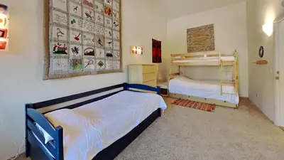 a bedroom with two beds and a bunk bed at 1849 Condos 631 home in Mammoth Lakes