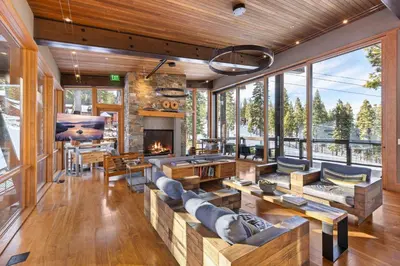 a living room filled with furniture and a fireplace at Stellar Ski-in Ski-out Out # 2 at Northstar 2 by Tahoe Getaways - Pet-Friendly 3BR Townhome w Loft, Shuttle and HOA! in Truckee-Tahoe Airport