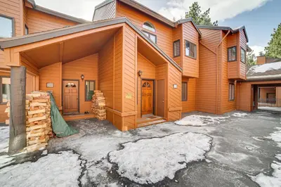 a wooden house with snow on the ground at Mammoth Lakes Condo Walk to Village and Gondola! in Mammoth Lakes