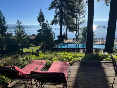 two chairs and a pool with a view of the water at 4BD Lakeside Retreat with Views in Tahoe City