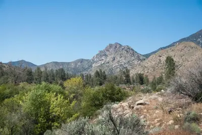 a mountain range with trees and mountains in the background at Corral Creek Lodge in Kernville