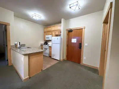 a kitchen with a sink and a refrigerator at Ski-in/Ski-out with views at Sunstone in Mammoth Lakes