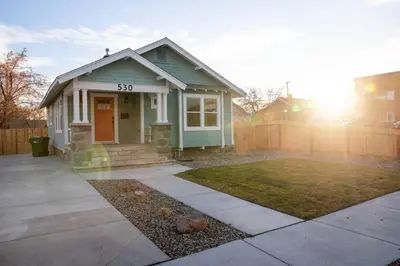 a small green house with the on it at Reno's Biggest Little House - Cozy Home Theatre in Reno