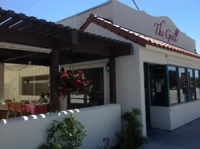 a restaurant with a sign that reads the grill at Historic Dow Hotel in Lone Pine