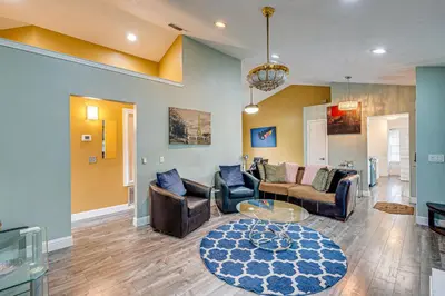 a living room with couches and a table at Cozy Antelope Home about 14 Mi to Sacramento! in Antelope