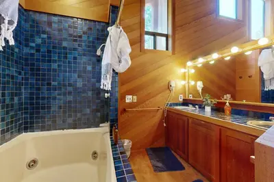 a bathroom with a tub and a sink at Timberline Daydream in Truckee