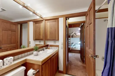 a bathroom with a sink and a mirror at Timberline Daydream in Truckee