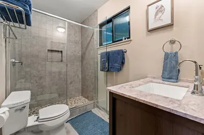 a bathroom with a shower and a toilet and a sink at Trailblazer Chalet at Olympic Valley with Private Hot Tub and Ski Shuttle in Alpine Meadows