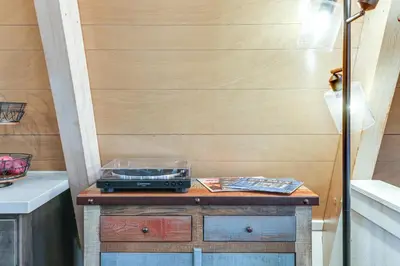 a radio sitting on a table in a room at 3 Mi to Calaveras Big Trees Cabin with Fire Pit! in Arnold