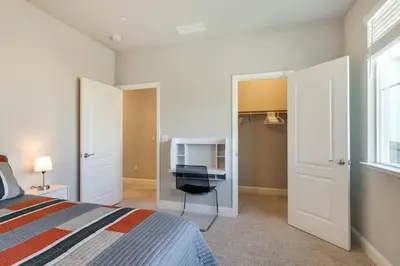a bedroom with a bed and a flat screen tv at Stylish Lodi Wine Country Retreat with Private Patio in Lodi
