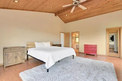 a bedroom with a bed and a ceiling fan at Murphys View in Murphys