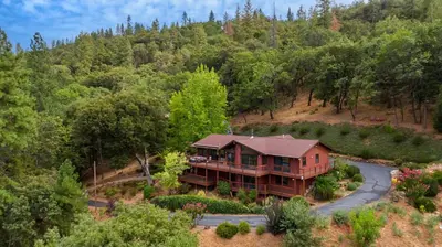 an aerial view of a house in the woods at Murphys View in Murphys