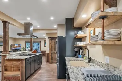 a kitchen with a sink and a refrigerator at 3BD with Hot Tub Two Minutes from King Beach in Tahoe Vista