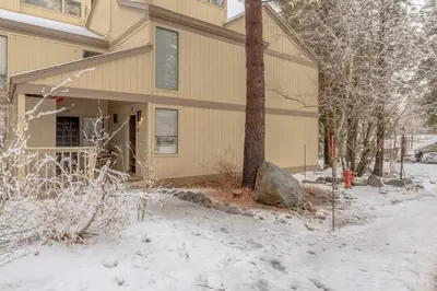 a building with a fire hydrant in the snow at 3BD Three Minutes from King Beach in Kings Beach