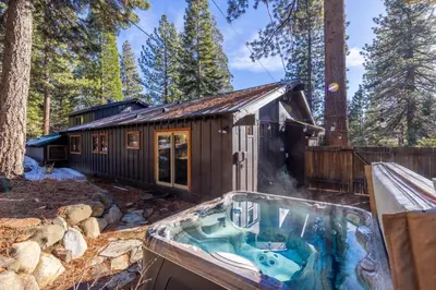 a house in the woods with a hot tub at Hideaway in the Highlands - 4BR, Pet Friendly w Hot Tub - Minutes from the Lake & Tahoe City in Tahoe City