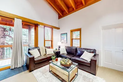 a living room with a couch and a table at Northstar Nirvana in Truckee