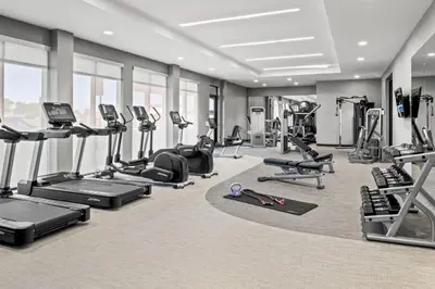 a gym with treadmills and cardio equipment in a building at Courtyard by Marriott Modesto North in Modesto