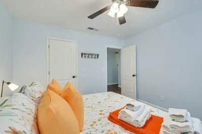 a bedroom with a bed with a ceiling fan at Bright and Cozy Mariposa Getaway 46 Mi to Yosemite! in Mariposa