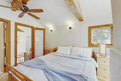 a bedroom with a bed and a ceiling fan at The Mountain House in Soda Springs
