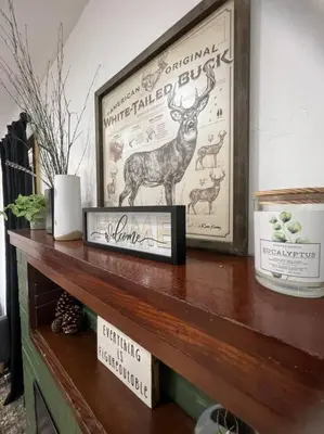 a wooden shelf with a picture of a deer on it at Modern Cabin, Near Snow Park, 3.5 Miles to SNP! in Three Rivers