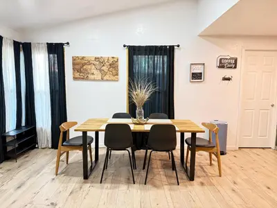 a dining room with a table and chairs at Modern Cabin, Near Snow Park, 3.5 Miles to SNP! in Three Rivers