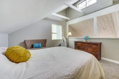 a bedroom with a large white bed and a window at Bay Area Escape on 5 Acres Pet Friendly, Views in Pilot Hill
