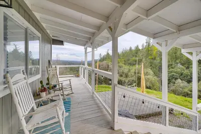 a porch with white rocking chairs and a view at Bay Area Escape on 5 Acres Pet Friendly, Views in Pilot Hill