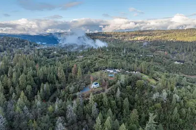 an aerial view of a forest with a house at Bay Area Escape on 5 Acres Pet Friendly, Views in Pilot Hill