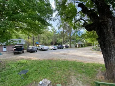 a bunch of cars parked in a parking lot at Seven Circles Lodge&Retreat in Badger