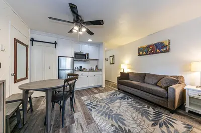 a living room with a couch and a table at Delightful Studio w/Kitchenette #111 at Donner Lake Village in Truckee