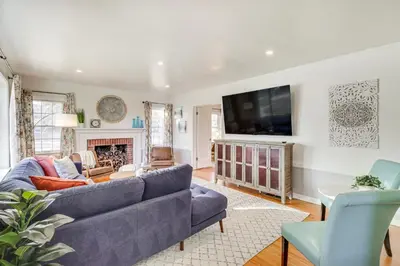 a living room with a couch and a tv at Less Than 1 Mi to Midtown Pet-Friendly Home in Reno! in Reno