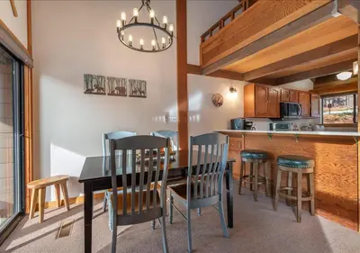 a dining room with a table and chairs in a kitchen at Northstar Resort Condo for 8 Free Shuttle in Truckee